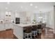 Bright kitchen featuring a center island with bar seating, modern appliances, and ample natural light at 9217 Rock Water Ct, Waxhaw, NC 28173