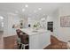Bright kitchen featuring a center island with bar seating, modern appliances, and ample cabinetry at 9217 Rock Water Ct, Waxhaw, NC 28173