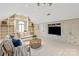 Spacious living room featuring built-in shelves, a vaulted ceiling, and modern decor at 9217 Rock Water Ct, Waxhaw, NC 28173