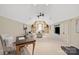 Bright living room featuring built-in shelving, a vaulted ceiling, and neutral decor at 9217 Rock Water Ct, Waxhaw, NC 28173