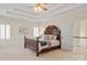Spacious main bedroom with a trey ceiling, a large bed, and bright windows at 9217 Rock Water Ct, Waxhaw, NC 28173