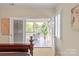 Main bedroom with french doors leading to a bright screened-in porch at 9217 Rock Water Ct, Waxhaw, NC 28173
