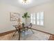 Cozy home office with a stylish desk, area rug, and natural light, offering a productive workspace at 9217 Rock Water Ct, Waxhaw, NC 28173