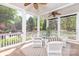 Inviting screened porch with comfortable seating and views of the landscaped backyard at 9217 Rock Water Ct, Waxhaw, NC 28173