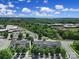 An aerial view of townhomes surrounded by lush greenery and neighborhood amenities at 9862 Walkers Glen Nw Dr, Concord, NC 28027