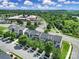 An aerial view of the townhomes nestled within mature trees and convenient community features at 9862 Walkers Glen Nw Dr, Concord, NC 28027