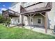 Backyard featuring a covered patio and a well-maintained lawn at 9862 Walkers Glen Nw Dr, Concord, NC 28027