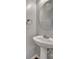 The bathroom features a pedestal sink and a decorative mirror at 9862 Walkers Glen Nw Dr, Concord, NC 28027