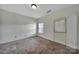 Bedroom featuring carpeted floors, a window, and an exterior door at 9862 Walkers Glen Nw Dr, Concord, NC 28027