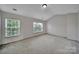 Spacious bedroom with natural light from two large windows at 9862 Walkers Glen Nw Dr, Concord, NC 28027