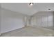 Neutral bedroom showing multiple doors and natural light at 9862 Walkers Glen Nw Dr, Concord, NC 28027