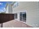 Exterior shot of a wood deck with sliding glass door to the house at 9862 Walkers Glen Nw Dr, Concord, NC 28027