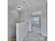 Upstairs hallway with carpet and a view of the bedroom at 9862 Walkers Glen Nw Dr, Concord, NC 28027