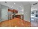 Open kitchen with stainless steel appliances, a wood floor, and an eat in kitchen view to the living space at 9862 Walkers Glen Nw Dr, Concord, NC 28027