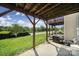 A view of the outdoor patio with natural light and surrounding green landscape at 9862 Walkers Glen Nw Dr, Concord, NC 28027