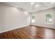 Inviting bedroom featuring wood floors and large windows at 1004 Toquima Trl, Monroe, NC 28110