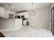 Dining area with modern light fixture and sliding glass door at 1004 Toquima Trl, Monroe, NC 28110