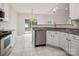 Kitchen view with stainless steel appliances, granite countertops, and white cabinets at 1004 Toquima Trl, Monroe, NC 28110