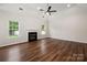 Bright living room boasts hardwood floors and a cozy fireplace at 1004 Toquima Trl, Monroe, NC 28110