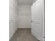 Spacious walk-in closet with ample storage space and shelving at 1034 Mapletree Ln, Indian Trail, NC 28079