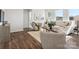 Comfortable living room with wood floors, neutral colors, and cozy seating arrangement at 1034 Mapletree Ln, Indian Trail, NC 28079