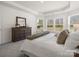 Comfortable main bedroom features soft carpet, decorative accents, and abundant natural light at 1034 Mapletree Ln, Indian Trail, NC 28079
