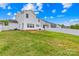 Spacious fenced backyard featuring a well-maintained lawn and patio area, perfect for outdoor living at 109 Fairfield Dr, Troutman, NC 28166