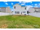 Fenced backyard with lush green lawn, perfect for outdoor activities and entertaining at 109 Fairfield Dr, Troutman, NC 28166