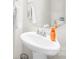 Bright bathroom features a pedestal sink, framed mirror, and neutral color palette at 109 Fairfield Dr, Troutman, NC 28166