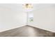 Well-lit room with vinyl flooring, ceiling fan, neutral paint, and a window allowing natural light at 109 Fairfield Dr, Troutman, NC 28166