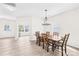 Bright dining room featuring light wood floors, and an exterior door at 109 Fairfield Dr, Troutman, NC 28166