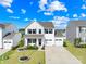 Charming two-story home with a well-manicured lawn, and a two-car garage at 109 Fairfield Dr, Troutman, NC 28166