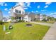 Charming two-story home with a well-manicured lawn, mature tree, and an American flag at 109 Fairfield Dr, Troutman, NC 28166