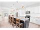 Modern kitchen featuring stainless steel appliances, granite countertops and large kitchen island with barstool seating at 109 Fairfield Dr, Troutman, NC 28166
