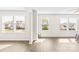 Bright living room featuring three large windows allowing for an abundance of natural light at 109 Fairfield Dr, Troutman, NC 28166