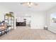 Large living room with an open-concept design into a well-equipped kitchen, perfect for modern living at 109 Fairfield Dr, Troutman, NC 28166