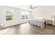 Bright main bedroom with hardwood floors, ceiling fan, and lots of natural light at 109 Fairfield Dr, Troutman, NC 28166
