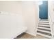Well lit mud room featuring storage and bench seating that adjoins the staircase at 109 Fairfield Dr, Troutman, NC 28166