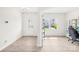 Well-lit office space featuring a back door and light wood floors at 109 Fairfield Dr, Troutman, NC 28166