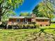 This home features a spacious backyard with a wooden deck, perfect for outdoor entertaining at 127 Edgeway Rd, Mooresville, NC 28117