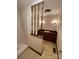 Unique bathroom with a walk-in shower, vanity, and dark wood cabinetry at 127 Edgeway Rd, Mooresville, NC 28117
