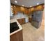 Traditional kitchen featuring wooden cabinetry and modern stainless steel appliances at 127 Edgeway Rd, Mooresville, NC 28117