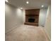 Cozy living room featuring a brick fireplace and neutral-toned carpet at 127 Edgeway Rd, Mooresville, NC 28117