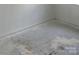 Spacious bedroom showing white walls and concrete floor and ready for new flooring at 13933 Eden Ct, Pineville, NC 28134