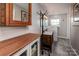 Bathroom featuring a double vanity, coat rack, and updated fixtures at 153 Coachman Loop, Statesville, NC 28625