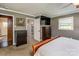 Bedroom featuring a connecting bathroom, walk-in closet, and mounted television at 153 Coachman Loop, Statesville, NC 28625