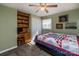 Comfortable bedroom with built-in shelves and a ceiling fan at 153 Coachman Loop, Statesville, NC 28625