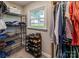 Walk-in closet featuring shelving for shoes, clothes, and accessories at 153 Coachman Loop, Statesville, NC 28625