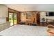 Dining area featuring wood paneled walls, hardwood flooring, and sliding glass doors to outdoor space at 153 Coachman Loop, Statesville, NC 28625