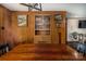 Dining room with hardwood floors and a built-in cabinet for storage at 153 Coachman Loop, Statesville, NC 28625